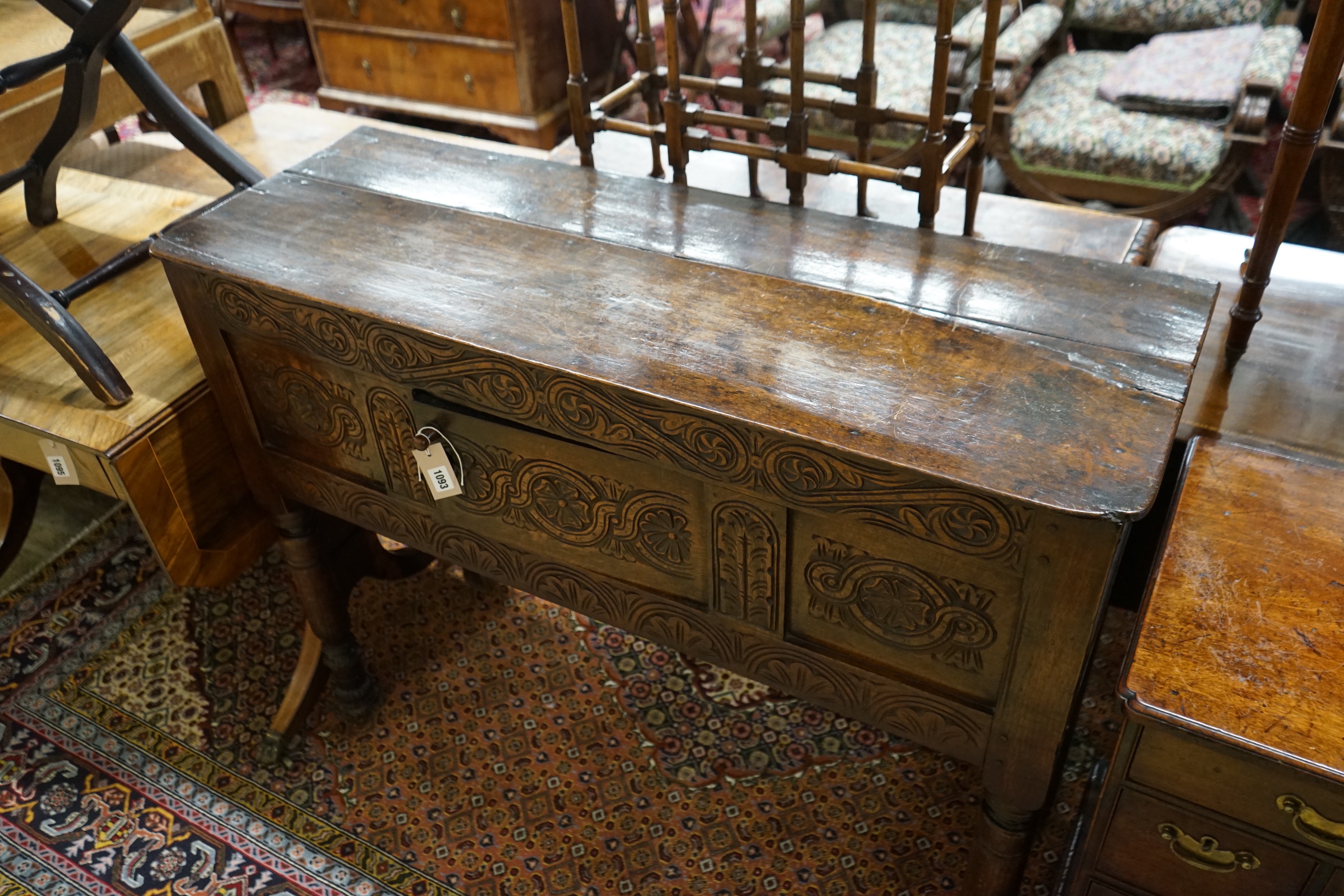 An 18th century and later carved oak cabinet on stand, width 118cm, depth 42cm, height 96cm